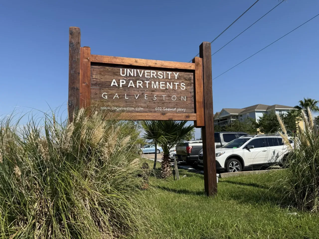 University Apartments Galveston property sign